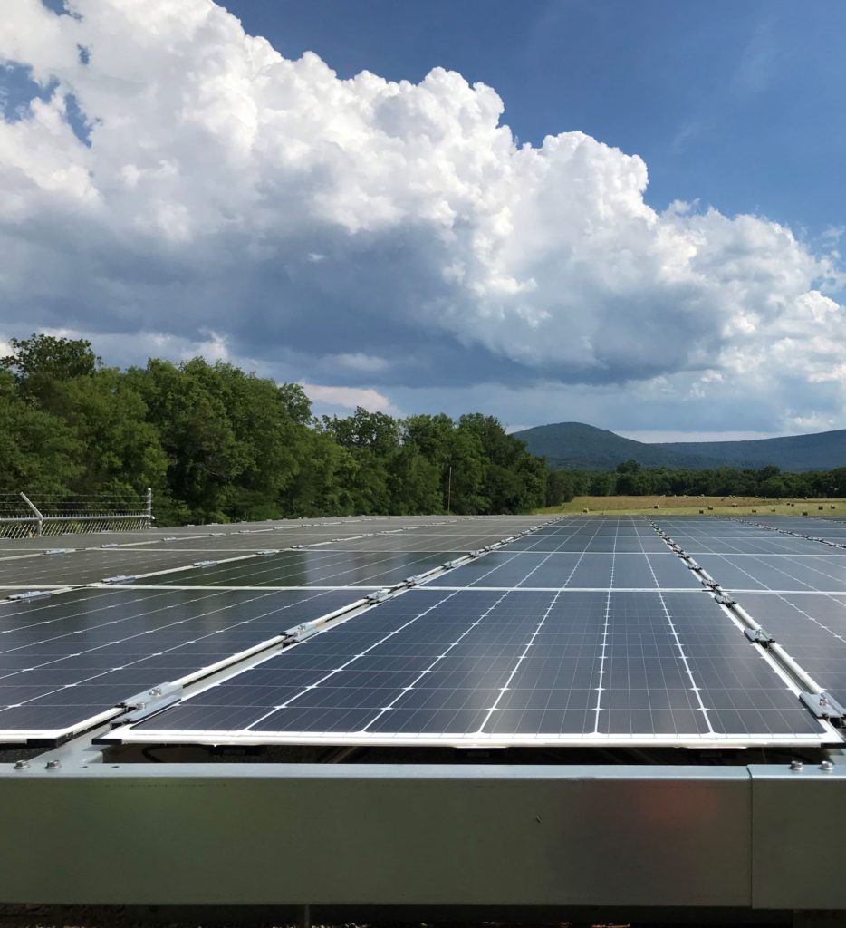 bifacial modules racked to avoid any backside shading by the solar canopy